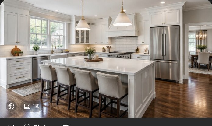 Remodeled luxury kitchen interior with white cabinetry and large island